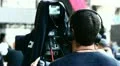 Cameraman with camera on stage at concert HD Footage
