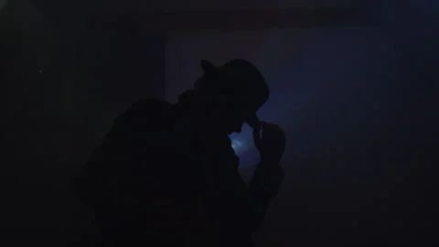 Cameraman captures stunning light rays with camcorder silhouette art Stock Footage 319946928