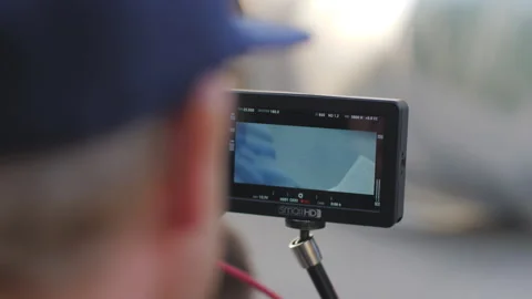 Cameraman controls process of filming on camera monitor Stock Footage 237510874