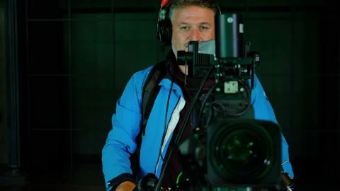 The cameraman counts down and points to a live television broadcast Stock Footage 147994268