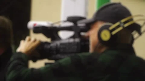 The cameraman is filming an interview at the event.  Stock Footage 279724623