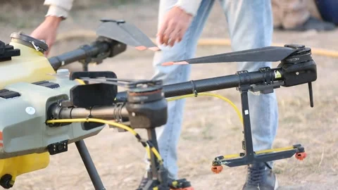 Cameraman is inspecting the drone Stock Footage 318848500