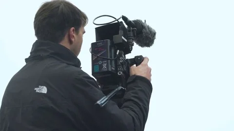 Cameraman Looking into Camera Stock Footage 83100546