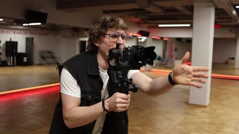 Cameraman making funny face Stock Footage 332116815