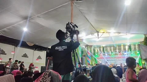 Cameraman recording the show Stock Footage 227999955