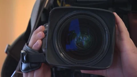 Cameraman shoots at the camera, close-up, Stock Footage 97181768
