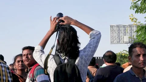 Cameraman taking low angle shot - Looking up in the Nikon camera while shooting 스톡 동영상 220169841