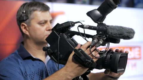 The cameraman is working behind the camera. Stock-Footage 94815691