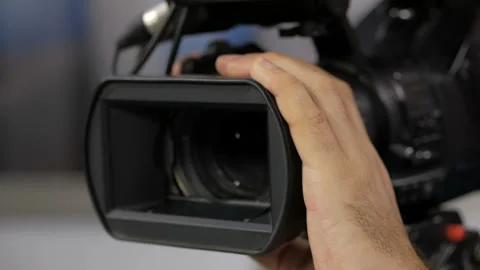 The cameraman is working behind the camera. Stock-Footage 94816815