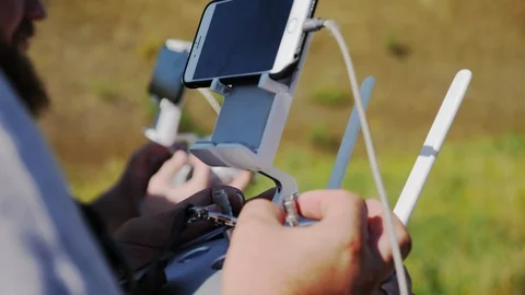 Cameramen control the drone Stock Footage 94234259