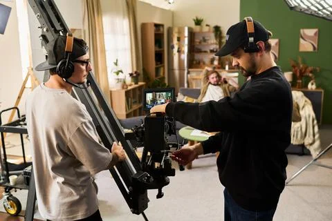 Cameramen Operating Video Camera Crane on Studio Film Set Stock Photos