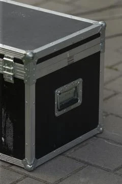 Cameras and audio devices kept inside sturdy textured black carrying case Stock Photos
