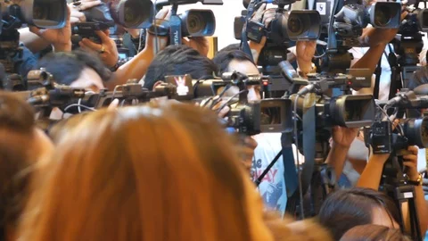 Cameras lined up covering public event Stock Footage 103301299