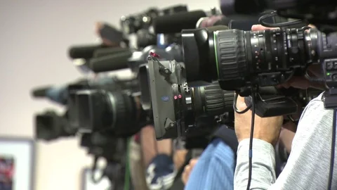 Cameras at a press conference Stock Footage 72658588