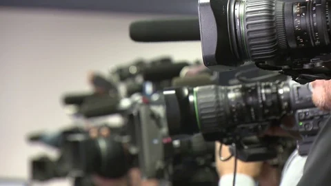 Cameras at a press conference Stock Footage