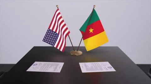Cameroon and USA at negotiating table. Business and politics 3D illustration. Illustrazione stock