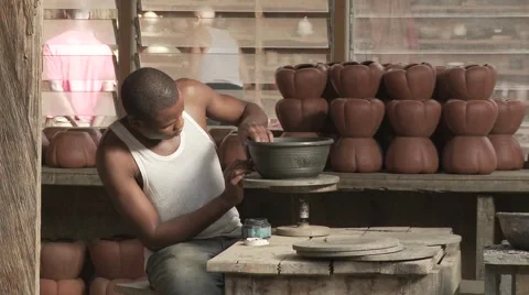 Cameroon potery, medium shoot, Potter with pots. Stock Footage 63905805