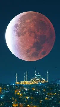 Camlica Mosque and lunar eclipse. Ramadan or islamic vertical photo Stock Photos