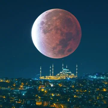 Camlica Mosque and lunar eclipse. Ramadan or islamic concept photo Stock Photos