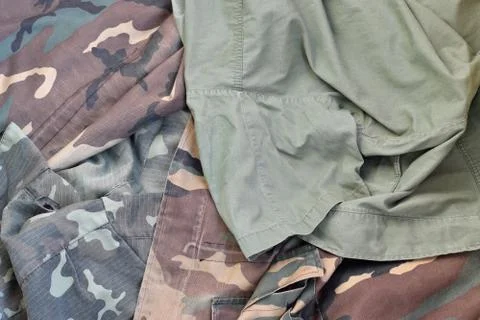 Camouflage background texture as backdrop for army and military design projec Stock Photos