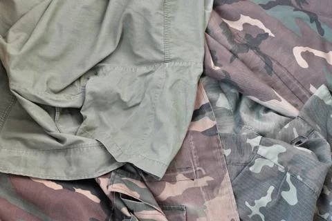 Camouflage background texture as backdrop for army and military design projec Stock Photos