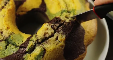 Camouflage pattern cake is sliced Stock Footage 245835785