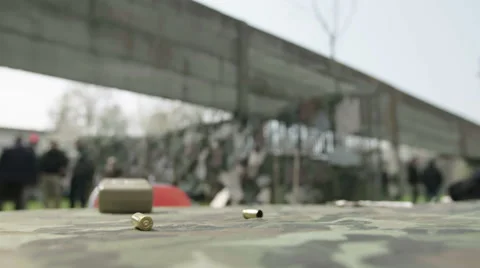 Camouflage Table with bullets, cards and gun before competition Stock Footage 64363175
