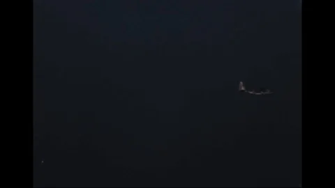 Camouflaged Lockheed AC-130 in flight during flight test - 1967-1968 Stock Footage 103678897