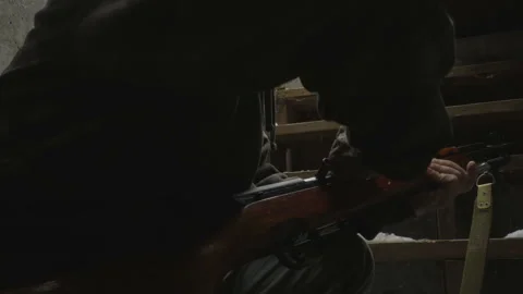 Camouflaged Man Loading a Semi Automatic Rifle Video stock 171052679