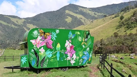 Camp with a caravan in the middle of a valley Stock Footage 127533837
