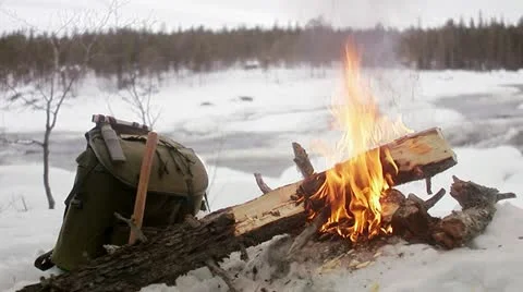 A camp fire and a backpack Stock-Footage 11333161