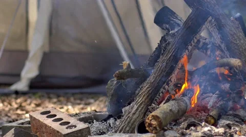 Camp fire in front of tent, 4K Stock Footage 47947113