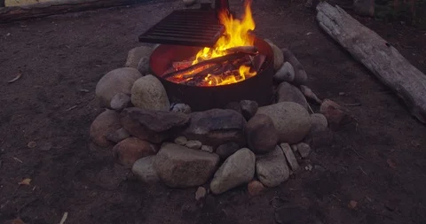 Camp fire with river in the background Stock Footage 116780919