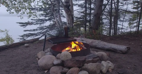 Camp fire with river in the background Stock Footage 116781272