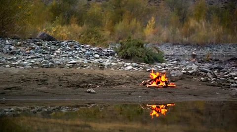 Camp Fire on the River Bank Stock Footage 49410962