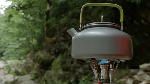 Camp gas burner, boil tea in nature Stock Footage