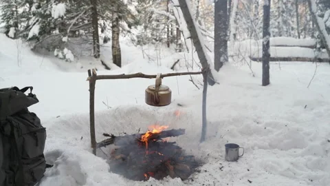 Camp kettle boils over a fire Stock Footage 148150802