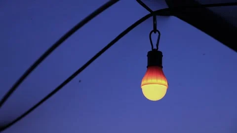 Camp Light hanging in Tent at Sunset, Camping Stock Footage 341366469