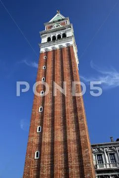 The campanile bell tower tall close up venice italy Stock Photos