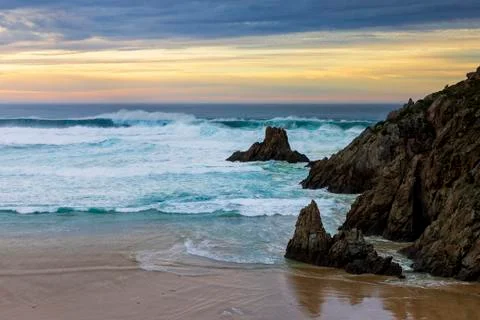 Campelo Beach at Dusk under Dramatic Yellow and Blue Sky Ferrol La Coruna Gal Stock Photos
