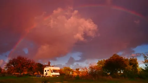 Camper camping on nature under the rainbow Stock Footage 143647766
