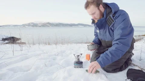 Camper Making Herbal Pine Needle Tea Using Portable Stove. - close up Stock Footage 169847323