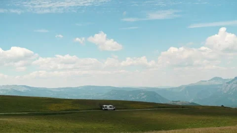 Camper van carrying bicycles drives across the Durmitor plateau near Sedlo Pass Vídeos de archivo 342409693