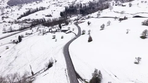 Camper Van Driving Into Snow Covered Mountain Landscape Видео 331587700