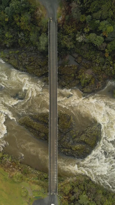 Camper van driving through bridge above a large mighty river in remote loca.. Stock Footage 288504398