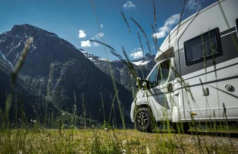 Camper Van on Mountain Landscape Background 写真素材