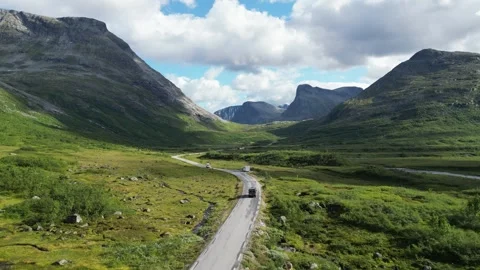 Camper Van RV drives scenic route to Trollstigen in Reinheimen National Stock Footage 256054705