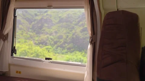 Camper van window view during scenic road trip through mountains Stock Footage 340260556