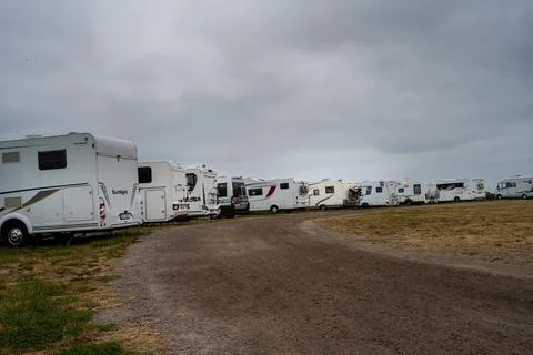 Camper vans with a dramatic sky in the background Foto stock