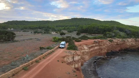 Campervan on Ibiza cliffs drone Renault Traffic Video stock 164613103